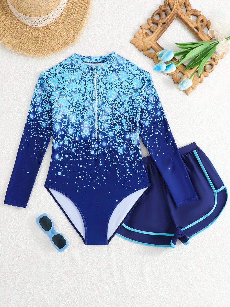SHEIN 1件少女连体泳衣,2件少女长袖泳衣短裤套装,新品上市。适合春夏海滩游泳。彩色泼墨渐变图案设计。亮丽浅色,时尚风格。舒适面料。浅蓝色和粉色设计,清新亮丽。 - 水鴨藍 - 查看 1