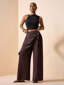 Zivah Lễ hội âm nhạc Xuân/Hè 2026, Lễ Phục Sinh, Ngày Thánh Patrick, Ngày Valentine, Hẹn hò, Phong cách miền Tây, Phong cách du mục, Tiệc sinh nhật, Lễ tốt nghiệp, Đại học, Sinh viên, Mặc hàng ngày, Phối đồ dễ dàng, Thường ngày, Kỳ nghỉ, Du thuyền, Bãi biển, Tắm nắng, Xu hướng thịnh hành, Thời trang đường phố, Khách dự đám cưới, Phong cách Boho, Đi làm, Ăn sáng muộn, Sân bay, Tiệc tùng, Đi chơi ngày lễ, Trang phục công sở. Quần ống loe nữ màu nâu chất liệu vải lanh, có dây buộc eo, ống quần hai lớp rộng rãi, có túi. - màu nâu - Xem 8