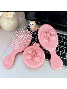 1个可爱卡通粉色蝴蝶结气囊梳，搭配奶泡按摩垫和便携式按摩迷你梳 - 黑色 - 查看 5