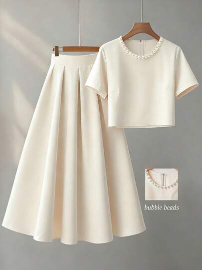 Franclia Ladies' Two-Piece Set, Ladies' Apricot-Colored Round-Neck Short-Sleeved Embroidered Top With Pleated Skirt Set, Elegant Evening Wear For Ladies, Formal Guest Attire For Ladies, Party And Birthday Dresses For Ladies, Stylish And Slim, Embroidered Beads And Pearls For Romantic Dates, Summer Style With Round Neck Top And Long Skirt Set, Casual 2pics.