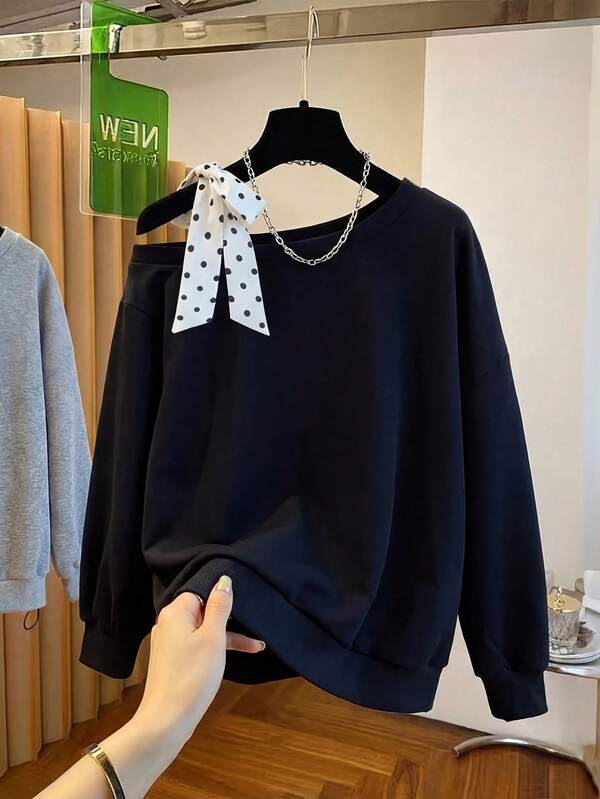 SHEIN Franclia 女士斜肩不规则领波点领结黑色宽松卫衣，舒适休闲，时尚优雅，适合日常穿着、婚礼、宴会、通勤、毕业派对、节日活动、度假等场合。撞色设计，天鹅绒面料。