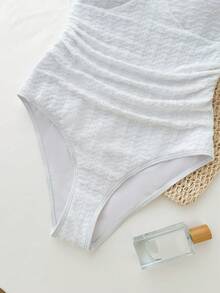 少女度假露背V领金属海星贝壳流苏装饰纹理针织连体泳衣