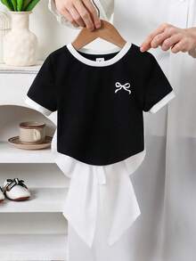 Emery Rose Kids Emery Rose Kids 女童针织纯色拼接修身露背短款上衣，露背设计，饰有O形环和大蝴蝶结，时尚法式优雅，适合返校季、Y2K风格、甜美别致的女性化风格。蝴蝶结衬衫，大蝴蝶结衬衫，可爱蝴蝶结衬衫，露背蝴蝶结衬衫，粉色蝴蝶结衬衫，露背蝴蝶结衬衫 - 黑與白 - 查看 10