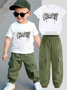 2pcs/Set Young Boys' Outfit, Includes White Short Sleeve T-Shirt With "COOLEST" Graffiti Print And Military Green Cargo Pants. Casual And Style To Showcase Kids' Lively And Energetic Personalized.