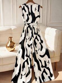 Franclia This Women's Black And White Abstract Print Deep V-Neck High-Waisted Jumpsuit With A Tie Is Suitable For Summer, Spring, Valentine's Day, Carnivals, Beach, Parties, Birthdays, Elegant Occasions, Vacations, Casual Wear, And Graduation Seasons. (Summer Outfits, Women's Summer Outfits, Spring Outfits, Spring Break Outfits, Women's Valentine's Day Outfits, Carnival Outfits, Women's Party Jumpsuits, Women's Elegant Outfits, Women's Holiday Outfits, Summer Vacation Outfits, Women's Casual Jumpsuits, White Jumpsuits, Women's Casual Wear)Fashionable Casual Commuter Wear, Business Office Wear, Versatile And Stylish Everyday Casual Wear, Urban Teacher's Professional Attire - Black and White - View 2