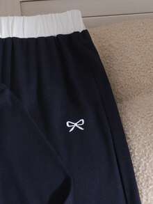 Sparklyn Bộ đồ thể thao đa năng 2 món dành cho thanh thiếu niên, gồm áo dài tay có cổ thêu nơ và quần ống rộng cạp chun cùng màu, thoải mái và thời trang cho mặc hàng ngày và tập luyện thể thao. - Màu xanh hải quân - Xem 4