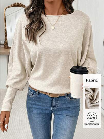 Editum Elegant rundhalsad t-shirt med mjuk aprikosfärgad långärmad dammodell, lämplig för vardagsbruk och flera tillfällen, höst/vinter