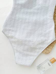 少女度假露背V领金属海星贝壳流苏装饰纹理针织连体泳衣