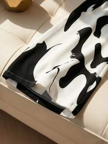 Franclia This Women's Black And White Abstract Print Deep V-Neck High-Waisted Jumpsuit With A Tie Is Suitable For Summer, Spring, Valentine's Day, Carnivals, Beach, Parties, Birthdays, Elegant Occasions, Vacations, Casual Wear, And Graduation Seasons. (Summer Outfits, Women's Summer Outfits, Spring Outfits, Spring Break Outfits, Women's Valentine's Day Outfits, Carnival Outfits, Women's Party Jumpsuits, Women's Elegant Outfits, Women's Holiday Outfits, Summer Vacation Outfits, Women's Casual Jumpsuits, White Jumpsuits, Women's Casual Wear)Fashionable Casual Commuter Wear, Business Office Wear, Versatile And Stylish Everyday Casual Wear, Urban Teacher's Professional Attire - Black and White - View 4