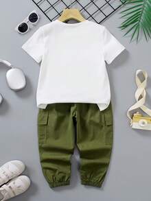 2pcs/Set Young Boys' Outfit, Includes White Short Sleeve T-Shirt With "COOLEST" Graffiti Print And Military Green Cargo Pants. Casual And Style To Showcase Kids' Lively And Energetic Personalized.