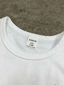 SHEIN Playful Pals Bộ 2 món cho bé trai, gồm áo không tay và quần short in họa tiết hình học hoa lá cổ điển, thích hợp cho mùa hè, thoáng khí, mặc ngoài trời, ở nhà, mặc thường ngày, phù hợp cho bé từ 6 tháng đến 3 tuổi. - trắng - Xem 7