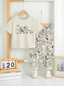 SHEIN 2 pièces/Set T-shirt à manches courtes ample et confortable et pantalon pour bébé garçon, convient pour le printemps/été. Imprimés mignons et classiques d'animaux de la bande dessinée comme zèbre, tigre, ours brun, lion, écureuil, hippopotame, éléphant - Multicolore - Voir 3