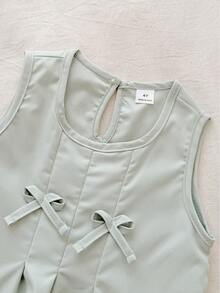 SHEIN Bộ đồ thể thao cho bé gái màu hồng và xanh lá cây trơn, kiểu dáng tối giản với nơ 3D trang trí, gồm áo không tay và quần dài, thích hợp mặc hàng ngày và đi nghỉ mát, mùa xuân/hè. - màu xanh lá - Xem 8