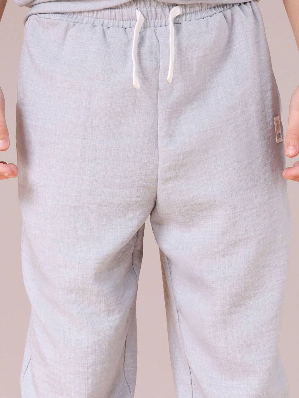 Completo camicia e pantaloni con bottoni sul davanti effetto lino
