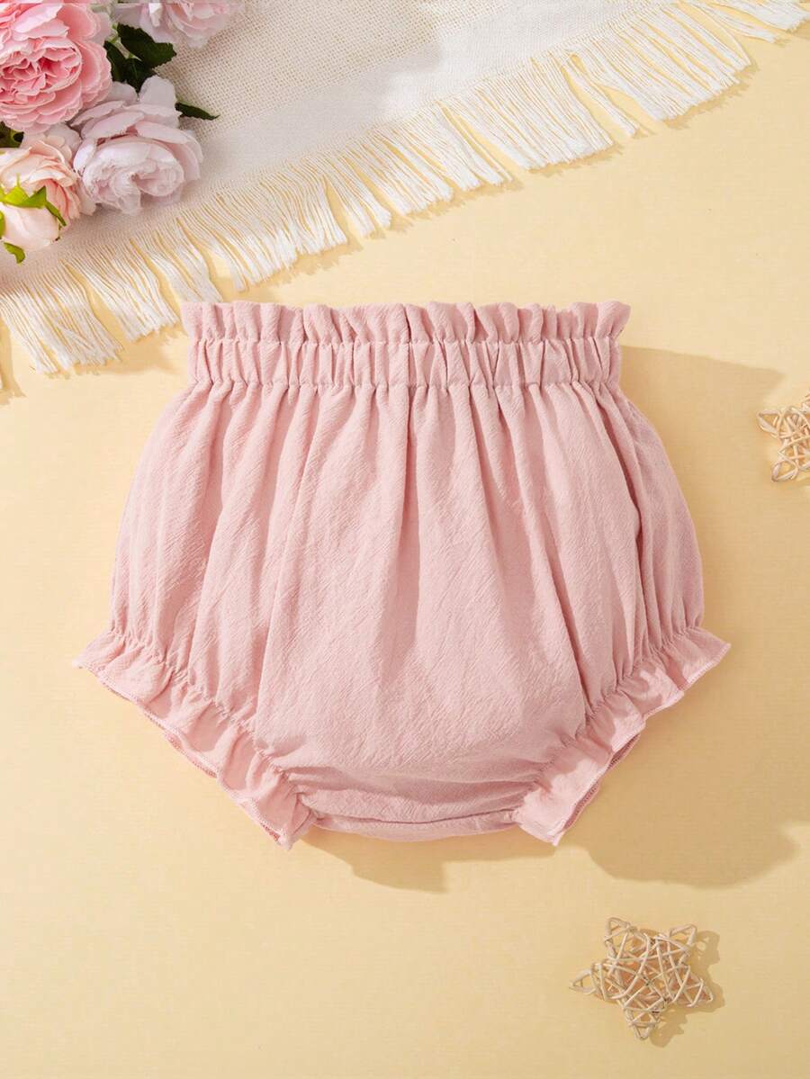 SHEIN Baby Girl Solid Color Ruffle Hem Pleated Shorts - Pink - View 1