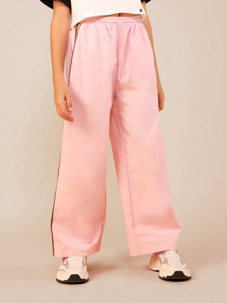 Joggers rosa con dettaglio a righe marroni