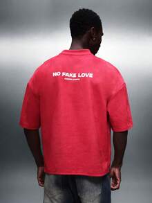 SUMWON Áo thun nam cổ tròn tay ngắn dáng rộng, kiểu crop top, in hình trái tim chảy nước và dòng chữ "No Fake Love" ở mặt sau, thích hợp mặc đi chơi vào ngày Valentine. - Đỏ - Xem 6