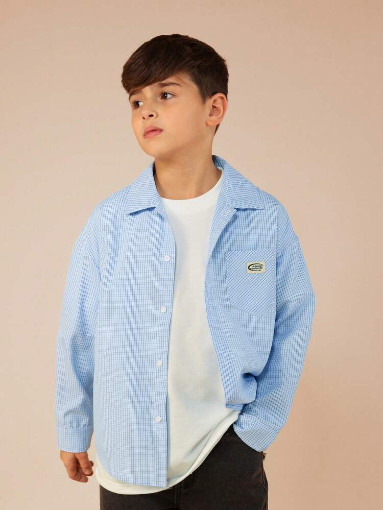 Chemise à carreaux à manches longues et col