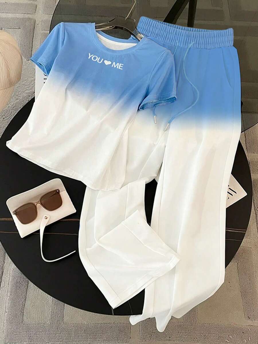 Resyla T-shirt med rund hals och korta ärmar i regular fit + byxor med raka ben och sneda fickor - Blå - Visa 1