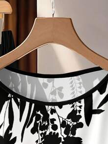 SHEIN Clasi 2pcs Women's Casual Elegant Minimalist Beige Shirt With Black-And-White Botanical Silhouette Print & Loose Black Pants Set. Perfect For Spring And Summer, Vacation, Country Style, Daytime, Garden, And Walking.