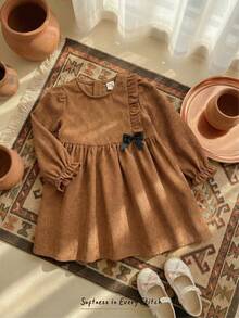 Cozy Pixies Baby Girl Textured Bow Decor Round Neck Long Sleeve Waist Cinched Dress - Brown - View 1