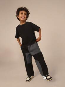 SUMWON Spodnie dresowe dla chłopców w bloki kolorów z kieszeniami bocznymi, elastyczny pas, styl jogger, wygodne spodnie zimowe z polaru, odzież codzienna dla dzieci - Czarne - Zobacz 6