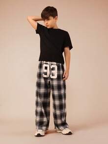 SUMWON Calça xadrez para pré-adolescentes com estampa de números grandes, cintura elástica, confortável e casual para férias. - Preto - Ver 3