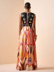 Zivah Lễ hội âm nhạc Xuân/Hè 2026, Lễ Phục Sinh, Ngày Thánh Patrick, Ngày Valentine, Hẹn hò, Phong cách miền Tây, Phong cách du mục, Tiệc sinh nhật, Lễ tốt nghiệp, Đại học, Sinh viên, Trang phục hàng ngày, Cơ bản, Đa năng, Thường ngày, Kỳ nghỉ, Du lịch tàu biển, Bãi biển, Tắm nắng, Phong cách thịnh hành, Thời trang đường phố, Khách dự đám cưới, Phong cách Boho, Đi làm, Ăn sáng muộn, Sân bay, Tiệc tùng, Đi chơi ngày lễ, Trang phục công sở. Đầm maxi chữ A không tay với họa tiết retro. - Hồng - Xem 2