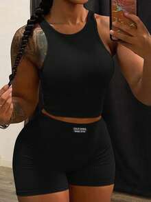 Slaydiva Bộ 2 món phong cách tối giản thường ngày: áo croptop cổ tròn không tay và quần short ôm eo cạp cao, chất liệu dệt kim gân dành cho nữ. - màu đen - Xem 7