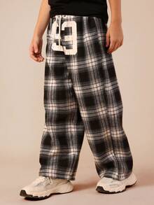 SUMWON Calça xadrez para pré-adolescentes com estampa de números grandes, cintura elástica, confortável e casual para férias. - Preto - Ver 4