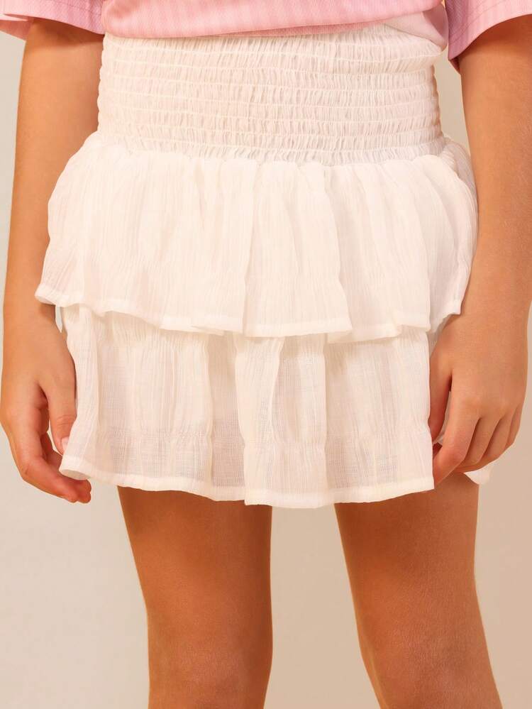 오버사이즈 티셔츠와 티어드 미니스커트 세트