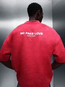 SUMWON Áo thun nam cổ tròn tay ngắn dáng rộng, kiểu crop top, in hình trái tim chảy nước và dòng chữ "No Fake Love" ở mặt sau, thích hợp mặc đi chơi vào ngày Valentine. - Đỏ - Xem 1