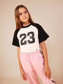 SUMWON Girls Number 23 Raglan Sleeve Crop Top Short Sleeve Baseball Style Graphic Tee Casual Boxy Fit Sports Inspired Top Vacation - Black and White - View 1