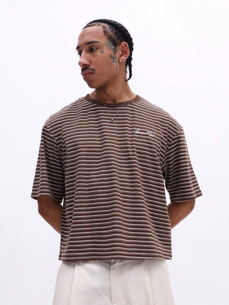 T-shirt rayé oversize avec logo brodé