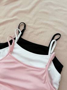 SHEIN Bộ 2 áo hai dây dệt kim màu đen trắng cho bé gái tuổi teen, có dây đeo điều chỉnh được và áo ngực có đệm, thích hợp mặc trong/ngoài, mùa xuân/hè. - Nhiều màu - Xem 7