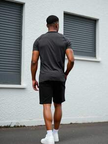 Manfinity Sport Corelite Camiseta deportiva de manga corta raglán con botones para hombres - Gris Oscuro - Ver 3