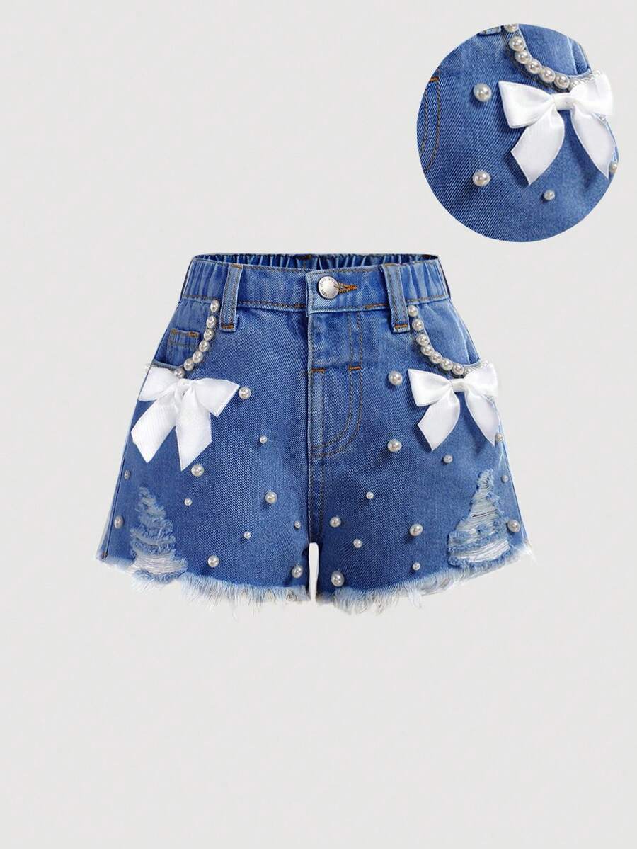 SHEIN Young Girl White Faux Pearl Decor Ribbon Bowknot Blue Denim Ripped Shorts, Spring And Summer Casual Vacation Country Boho Wear, Beach, Western Street Wear For Girl, Spring Break, Rave Festival Denim Shorts - Medium Wash - View 1