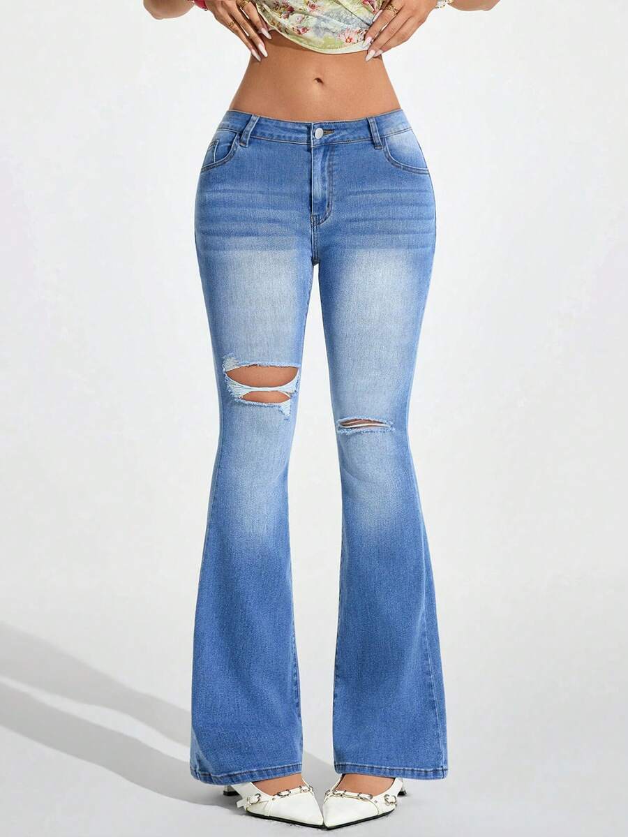 Jeanoix Dammode i slitna, tvättade, utsvängda jeans med fickor - Blå - Visa 1