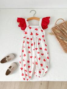 Cozy Pixies Bộ áo liền quần cổ tròn cho bé gái nhân dịp Lễ Tình nhân, họa tiết trái tim đỏ, nơ 3D trang trí, viền bèo nhún, đa năng và thoải mái, chi tiết nơ đỏ, in hình trái tim, trang phục bé gái, quần yếm nơ, áo liền quần cotton cho bé gái. - Đỏ - Xem 2