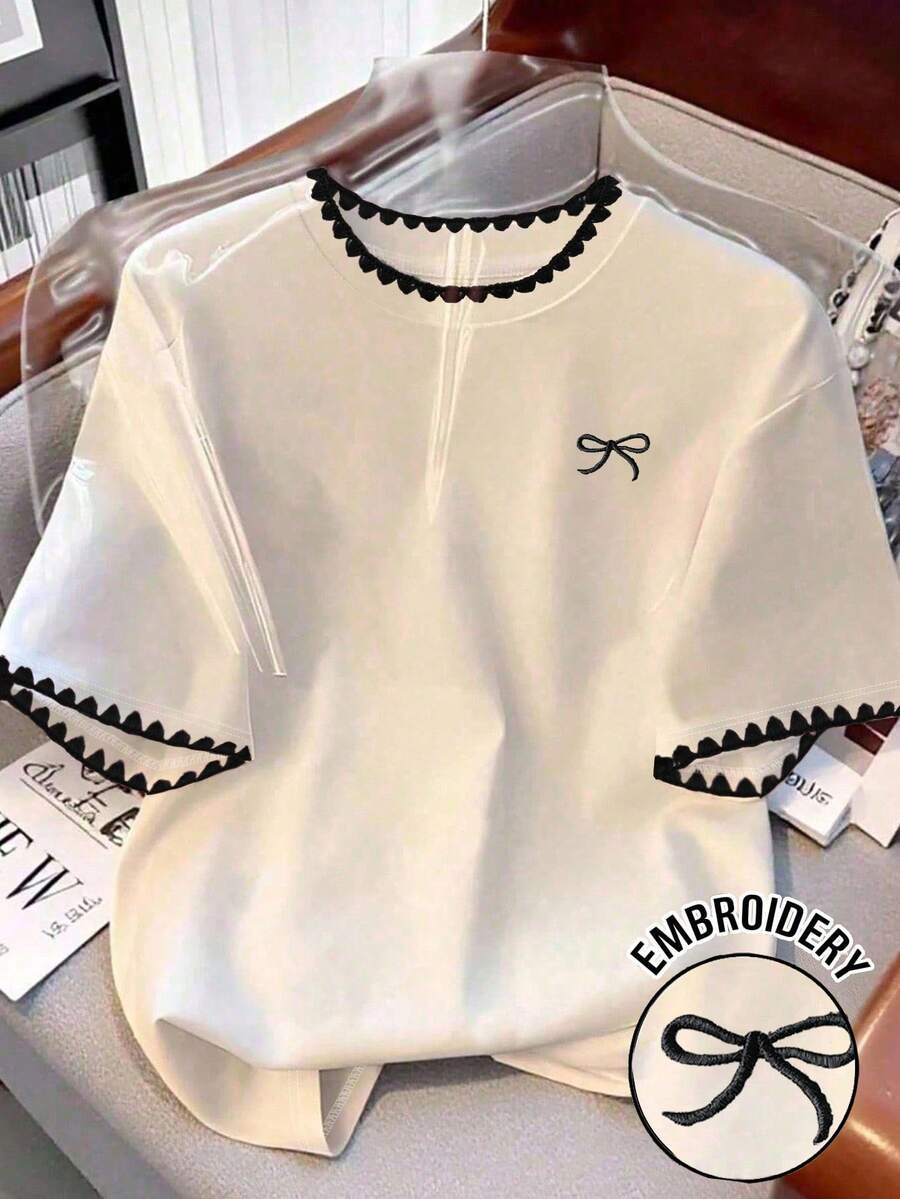 Resyla Áo thun ngắn tay nữ kiểu dáng thường ngày, in họa tiết nơ và răng cưa, thiết kế thanh lịch, đa năng, phù hợp cho đi học, ngày Nhà giáo, mùa hè, hoạt động ngoài trời, thường ngày, hẹn hò, thể thao. - trắng - Xem 1