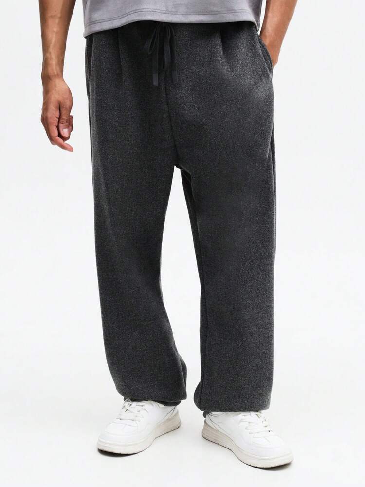 Męskie spodnie dresowe z szerokimi nogawkami, plisowane, ze ściągaczem w pasie, luźne, w stylu streetwear