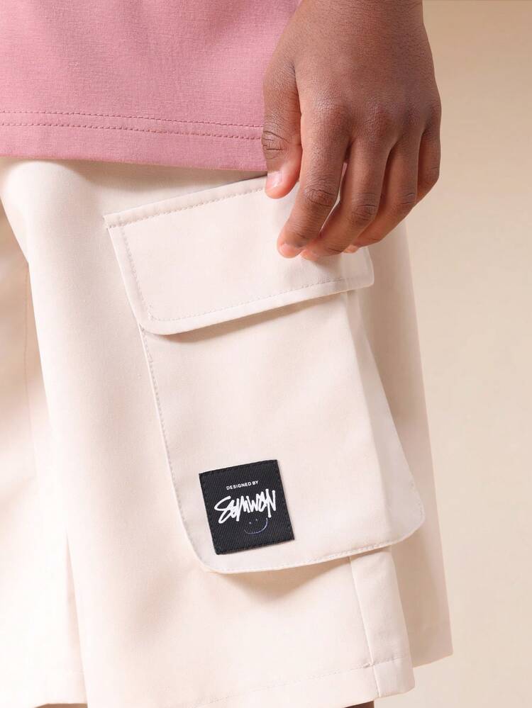 Conjunto de camiseta y pantalones cortos cargo en tonos pastel