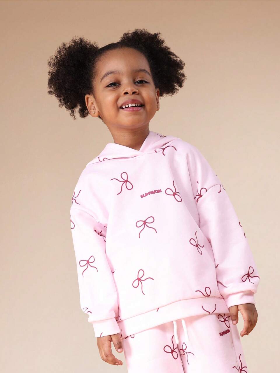 Conjunto de moletom com capuz e calça jogger com estampa de laço
