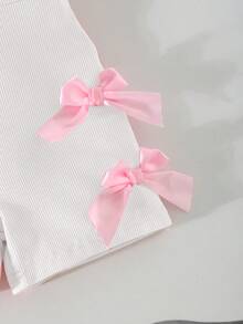 SHEIN Bộ áo liền quần ngắn không tay, chất liệu vải thun gân, trang trí nơ, màu hồng, thích hợp cho bé gái mùa hè, dự tiệc, quần áo mùa hè cho bé gái, áo liền quần cho bé gái sơ sinh, bộ áo liền quần cho bé gái mới sinh. - trắng - Xem 4