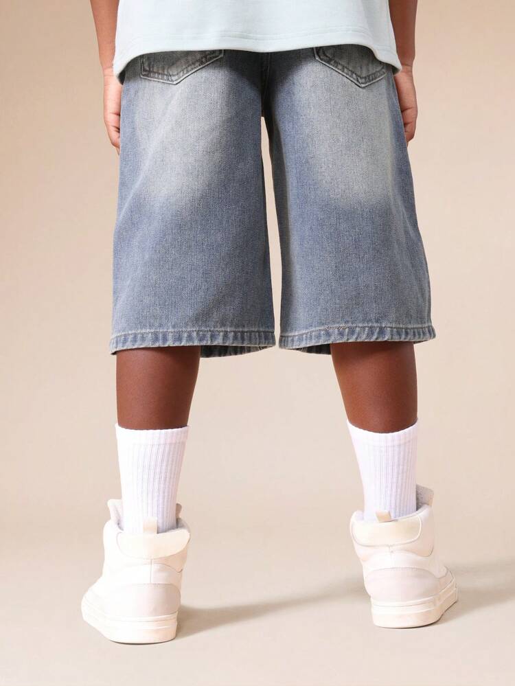 Pantaloni in denim a gamba larga con lavaggio medio