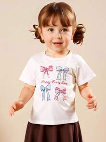 SHEIN Genkimix Kids 女童圆领休闲短袖T恤，白色底色，饰以水彩风格的粉蓝色蝴蝶结印花，甜美俏皮，适合夏季日常穿着、上学、与朋友外出、主题派对等场合，清新可爱，轻松打造甜美小公主造型。 - 白色 - 查看 6