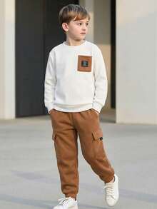 1. 男童休闲针织纹理圆领卫衣和抽绳工装口袋裤运动套装，Y2K风格，适合春夏、郊游、情人节、约会、旅行、度假、家庭聚会、返校、婚礼、正式活动、运动、生日派对等场合 - 彩色 - 查看 1