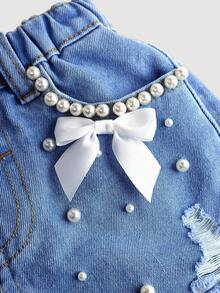 SHEIN Young Girl White Faux Pearl Decor Ribbon Bowknot Blue Denim Ripped Shorts, Spring And Summer Casual Vacation Country Boho Wear, Beach, Western Street Wear For Girl, Spring Break, Rave Festival Denim Shorts - Medium Wash - View 3