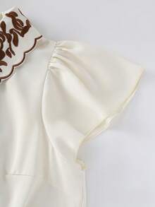 GlowEve ملابس علوية نسائية بأكمام قصيرة مطرزة على الياقة، أنيقة للارتداء اليومي والعمل والعطلات، لون المشمش، أكمام قصيرة مناسبة للربيع المبكر والخريف - لون مشمشي - مشاهدة 5