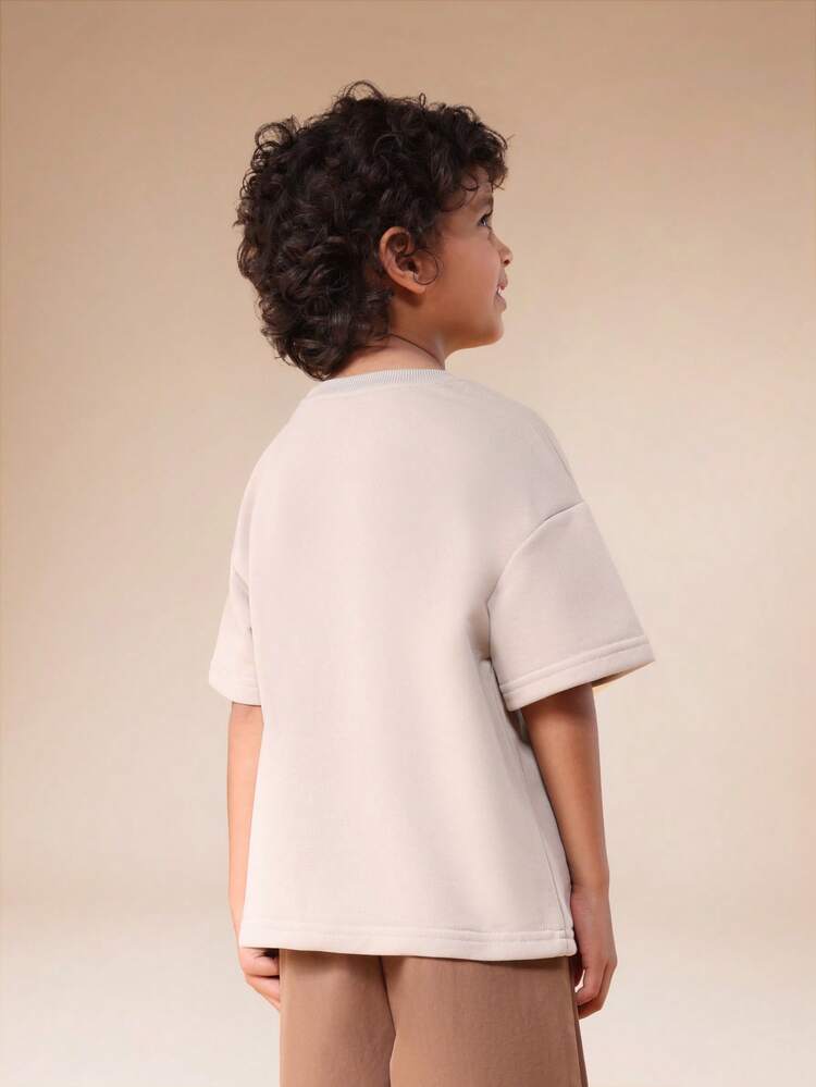 Maglietta oversize con tasca sul petto